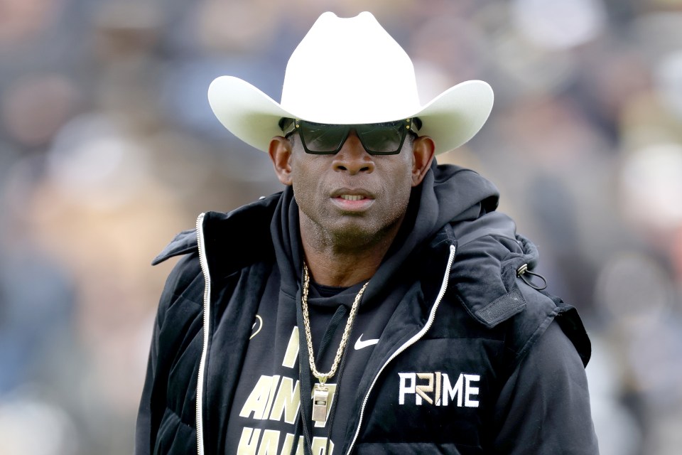 Deion Sanders, head coach of the Colorado Buffaloes, watching his team warm up.