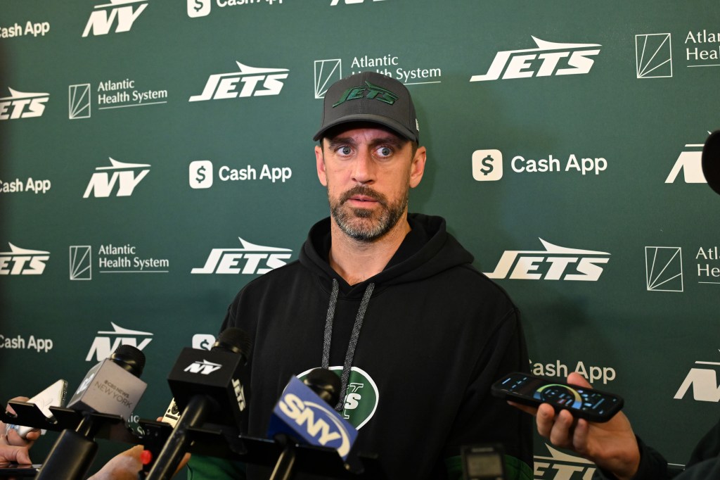 Aaron Rodgers speaks to the media.