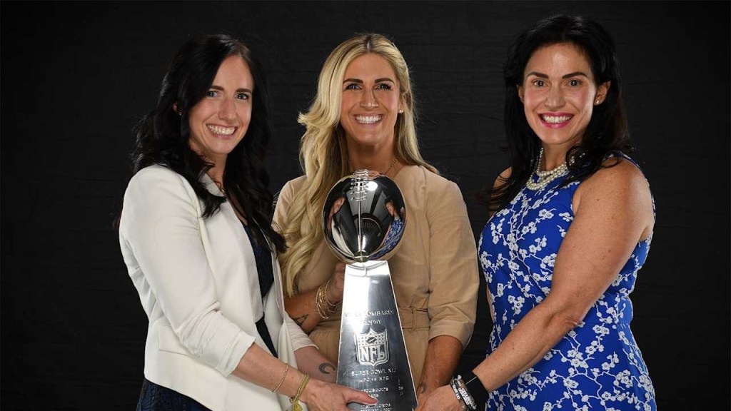 Kalen Jackson, Casey Foyt, and Carlie Irsay-Gordon holding the Vince Lombardi Trophy.