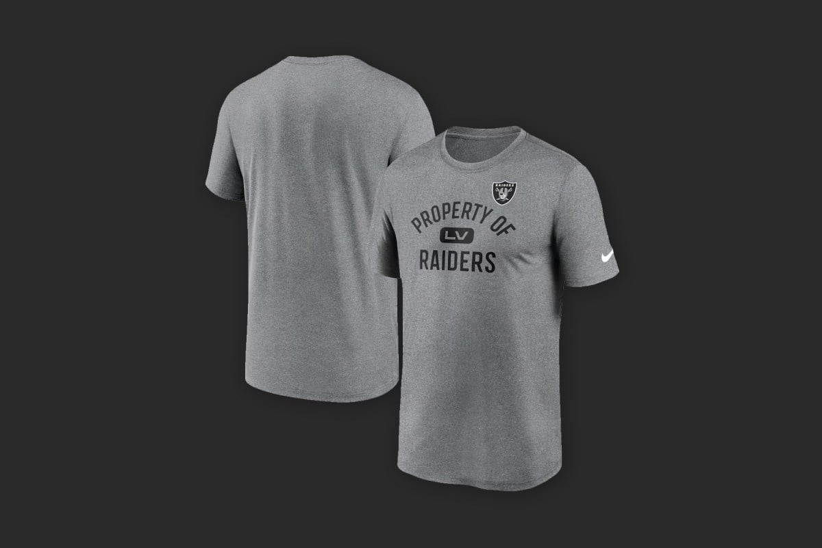 The Las Vegas Raiders Nike Legend performance t-shirt in silver against a dark gray background.