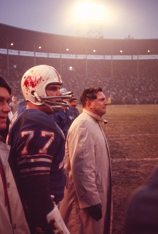 Buffalo Bills coach Lou Saban and left tackle Stew Barber (#77) on the sidelines during the 1964 AFL Championship Game.