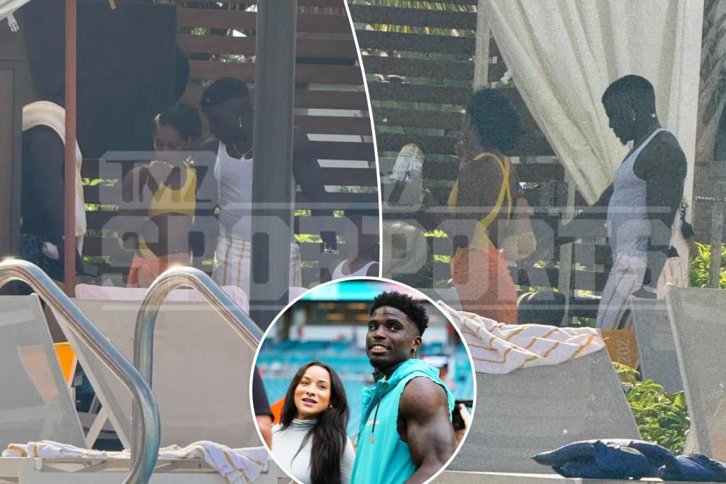 Tyreek Hill gets flirty with mystery woman in pool after wife's divorce filing