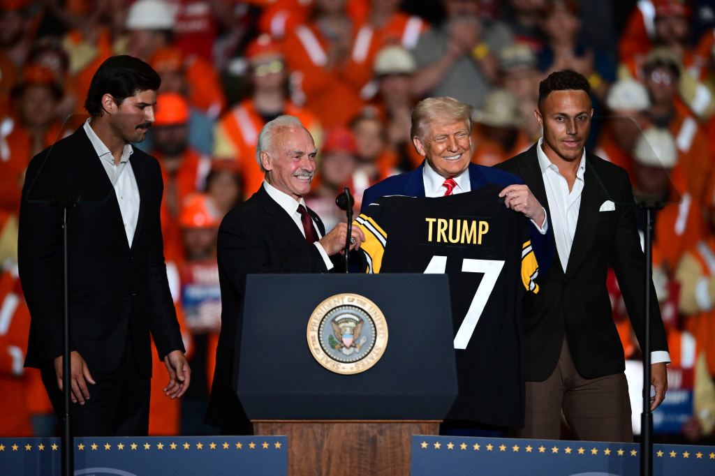 President Trump holds a steelers jersey at a May 2025 event.