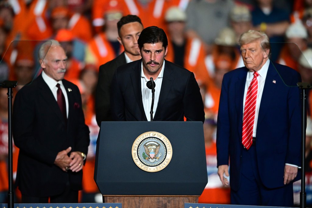 Mason Rudolph speaking at a podium with Donald Trump and others nearby.