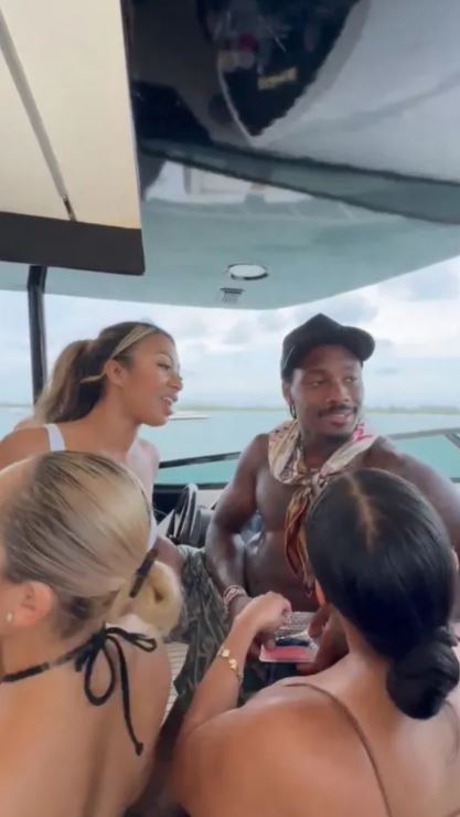 Stefon Diggs with friends on a boat.