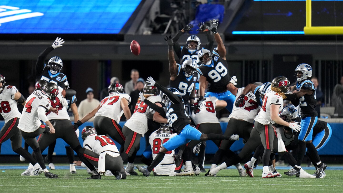 McLaughlin's field goal in OT helps Bucs beat Panthers 26-23, move into 1st-place tie in NFC South