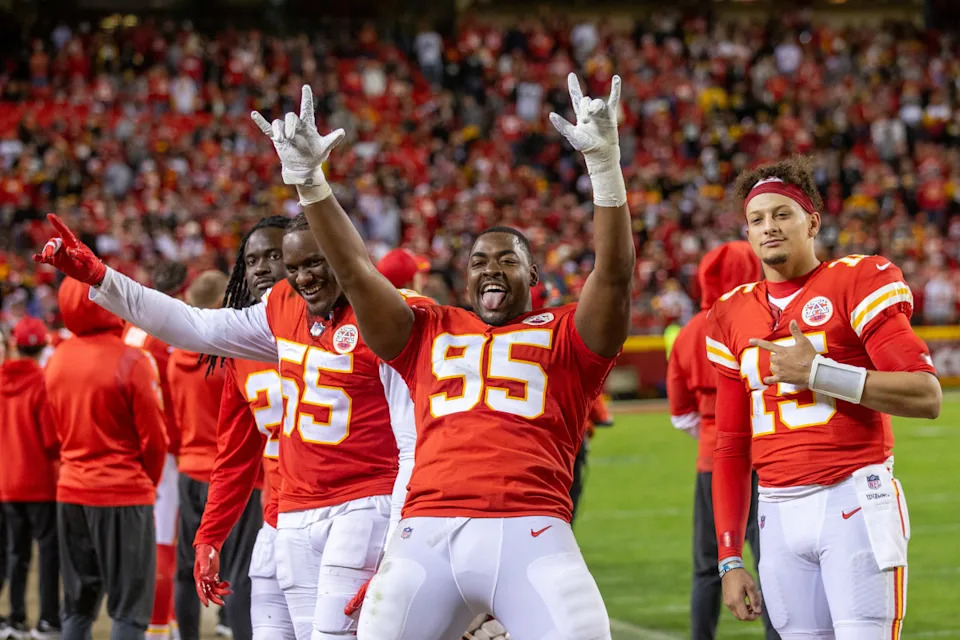 Dec 26, 2021; Kansas City, Missouri, USA; Kansas City Chiefs defensive end Chris Jones (95) and defensive end Frank Clark (55) and quarterback Patrick Mahomes (15) pose for pictures as the game against the Pittsburgh Steelers winds down at GEHA Field at Arrowhead Stadium.© William Purnell-Imagn Images