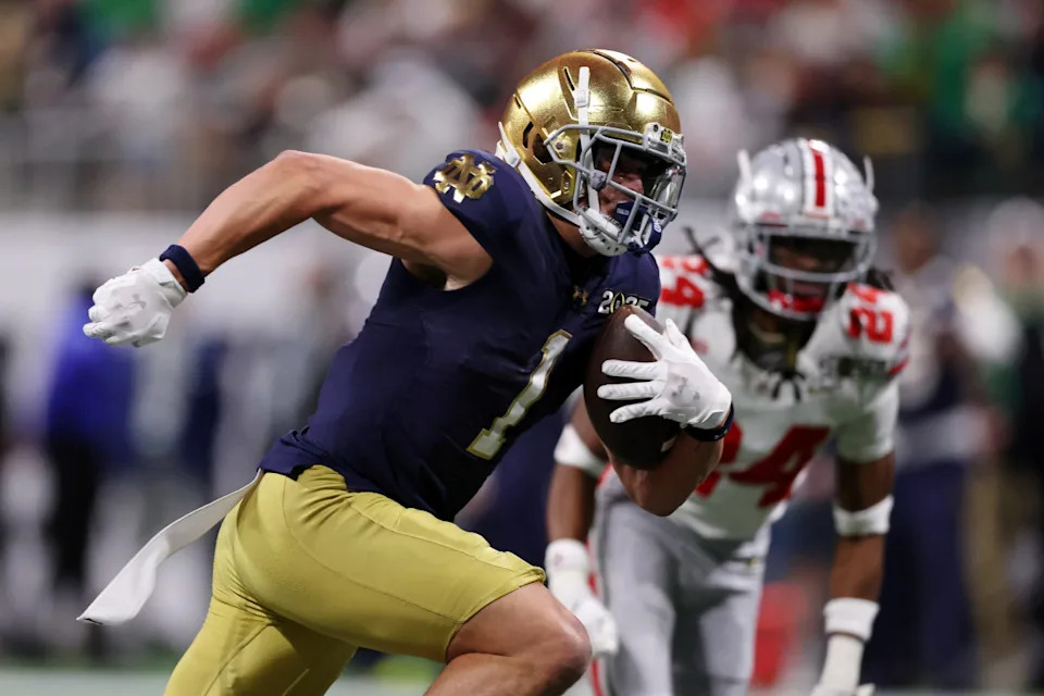 Jan 20, 2025; Atlanta, GA, USA; Notre Dame Fighting Irish wide receiver Jaden Greathouse (1) runs with the ball for a touchdown against the Ohio State Buckeyes during the second half of the CFP National Championship college football game at Mercedes-Benz Stadium. © Brett Davis-Imagn Images