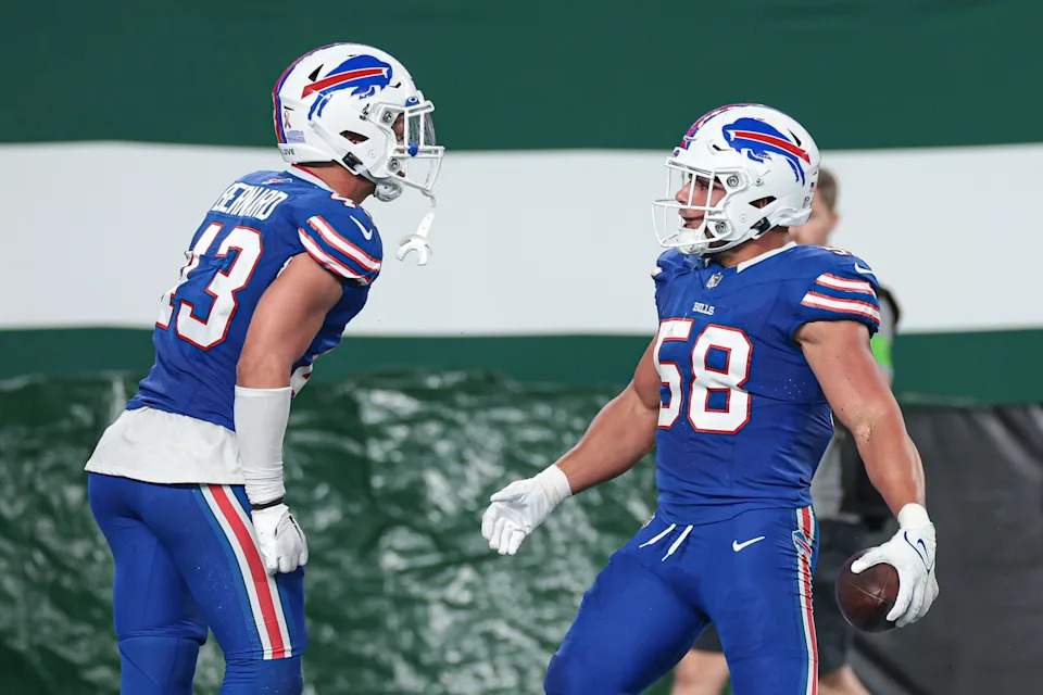 Sep 11, 2023; East Rutherford, New Jersey, USA; Buffalo Bills linebacker Matt Milano (58) reacts after his interception with linebacker Terrel Bernard (43) during the first half against the New York Jets at MetLife Stadium. Mandatory Credit: Vincent Carchietta-USA TODAY Sports
