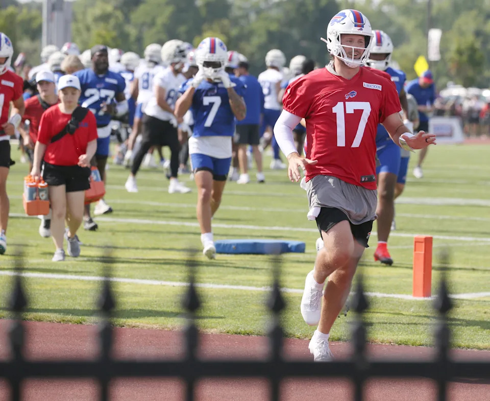 Bills quarterback Josh Allen races to the back practice field ahead of the rest of the quarterback unit during the second day of Buffalo Bills training camp at St. John Fisher University Thursday, July 24, 2025 in Pittsford.