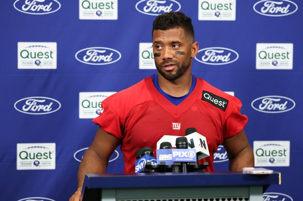 Russell Wilson talks to reporters during Giants training camp in East Rutherford, New Jersey