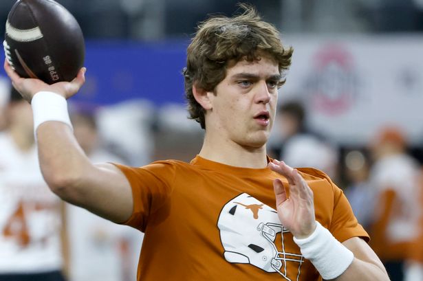 Arch Manning #16 of the Texas Longhorns throws prior to the Goodyear Cotton Bowl against the Ohio State Buckeyes at AT&T Stadium on January 10, 2025 in Arlington, Texas