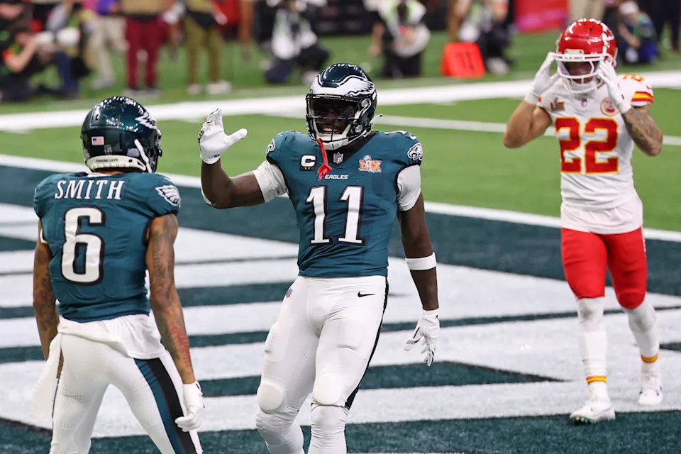 Feb 9, 2025; New Orleans, LA, USA; Philadelphia Eagles wide receiver A.J. Brown (11) congratulates wide receiver DeVonta Smith (6) after he scored a touchdown against the Kansas City Chiefs during the second half of Super Bowl LIX at Caesars Superdome. Mandatory Credit: Bill Streicher-Imagn Images