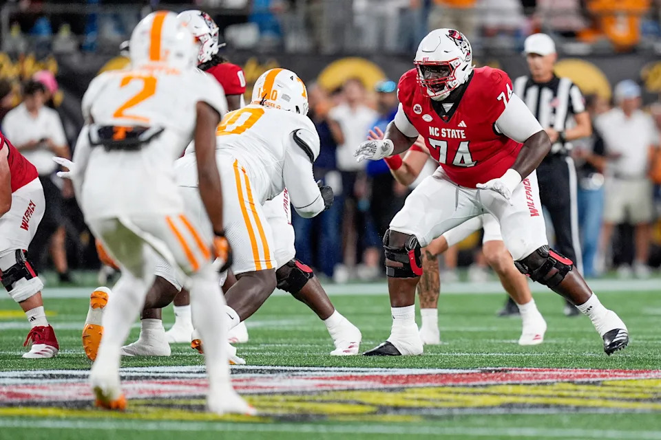 Sep 7, 2024; Charlotte, North Carolina, USA; North Carolina State Wolfpack offensive tackle Anthony Belton (74) during the first quarter against the Tennessee Volunteers at the Dukes Mayo Classic at Bank of America Stadium. Mandatory Credit: Jim Dedmon-Imagn Images
