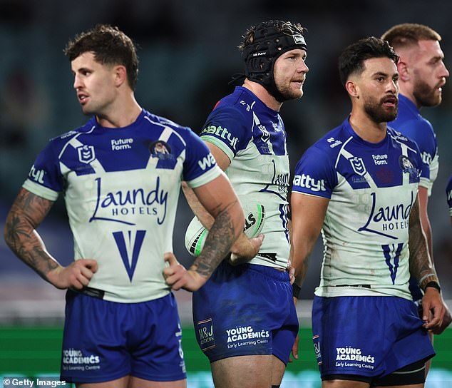 Security at Sydney's Accor Stadium have studied video footage in a bid to identify the person responsible after a Bulldogs fan reportedly hurled a bottle at the Broncos bench following their dramatic victory on Friday (pictured, Canterbury players after conceding a try)