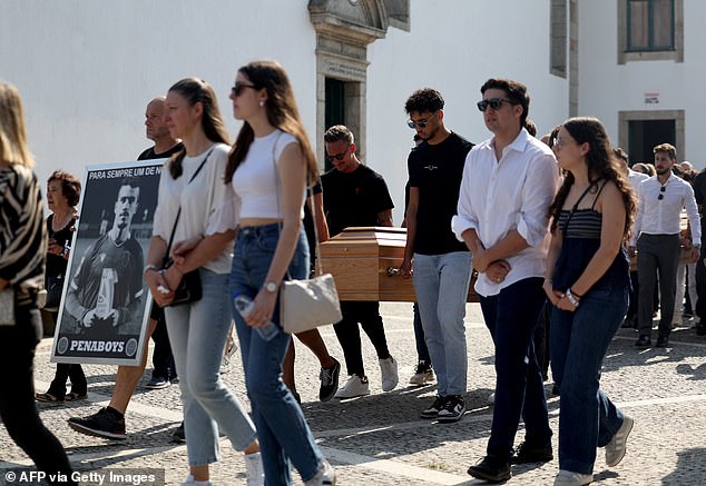 The coffins of Diogo Jota and his brother Andre are carried through the streets of Gondomar during a joint funeral procession
