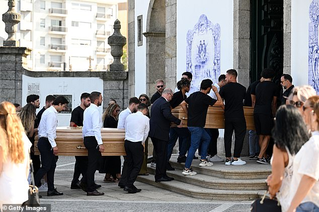 The coffins of Diogo Jota And Andre Silva are carried by family, former teammates and friends into the Igreja Matriz de Gondomar where the funeral is being held