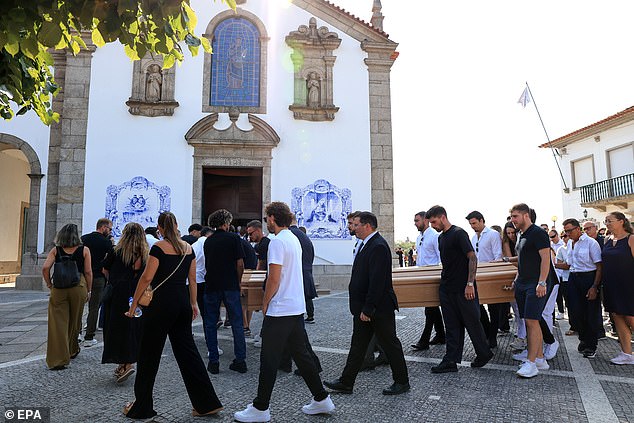 Pallbearers carry the caskets of late Portugal's player Diogo Jota and his brother Andre Silva during their funeral on Saturday. Portugal teammate Ruben Neves can be seen as one of the pallbearers for Diogo's coffin