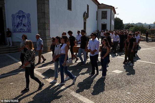 Pallbearers carry the coffins of Portuguese footballers and brother Diogo Jota and Andre Silva