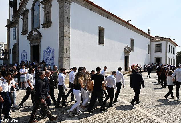 Diogo Jota's wife Rute Cardoso walks behind the coffin of her late husband following his funeral service
