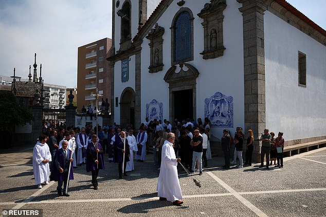 The congregation leaves the church in Gondomar following the funeral service on Saturday