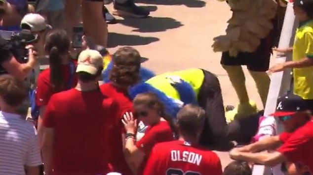 The two wrestled to the ground and stayed there for several seconds before being separated