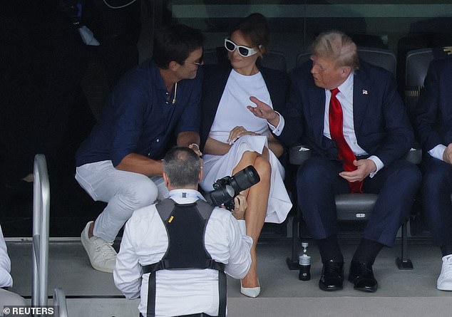 Brady was captured deep in conversation with Trump and First Lady Melania Trump
