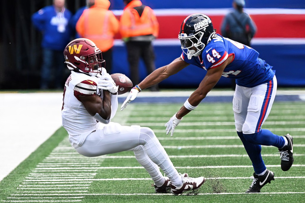 Giants cornerback Nick McCloud (44) breaks up a pass intended for Washington Commanders wide receiver Terry McLaurin (17) during the second  quarter at MetLife Stadium in East Rutherford, N.J.
