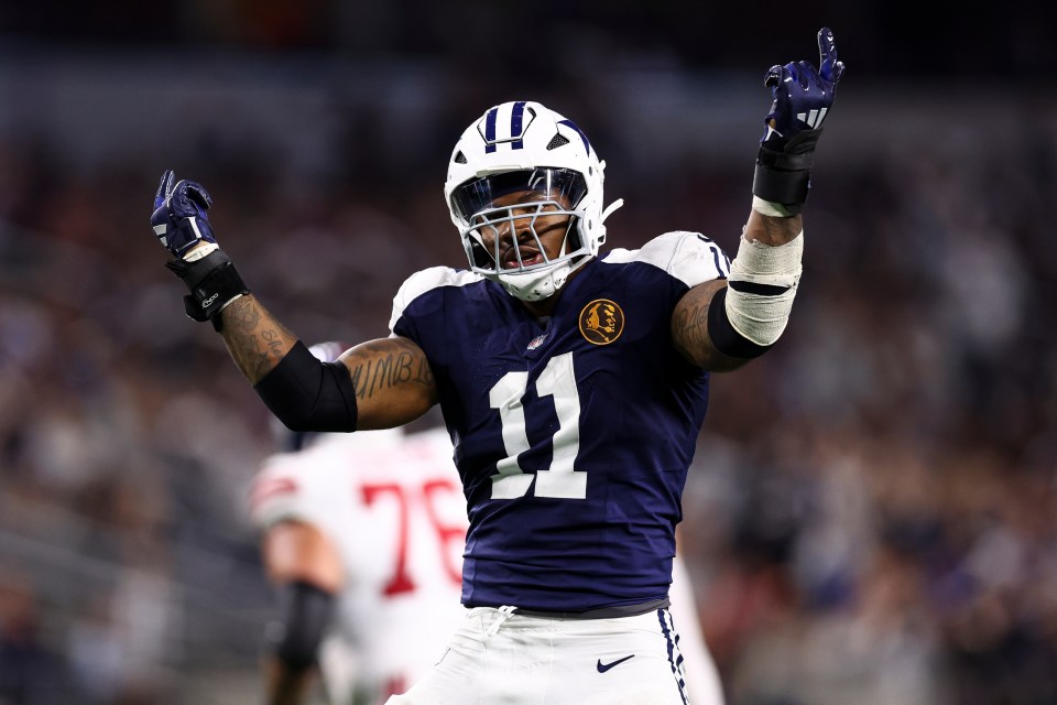 Micah Parsons #11 of the Dallas Cowboys celebrates after a sack.