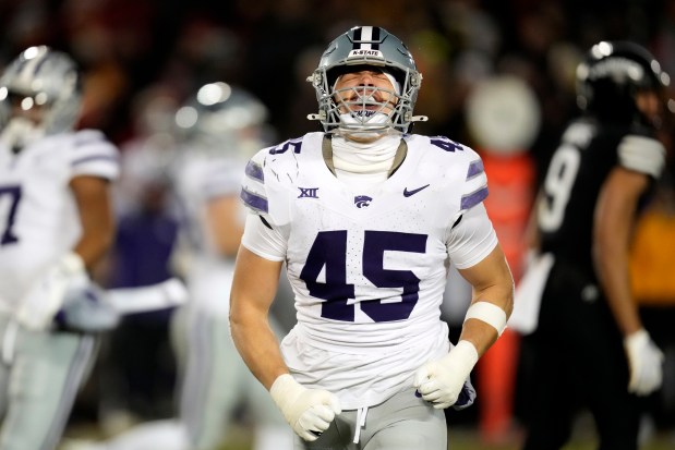 Kansas State linebacker Austin Romaine (45) celebrates after breaking up a pass during the first half of an NCAA college football game against Iowa State, Saturday, Nov. 30, 2024, in Ames, Iowa. (AP Photo/Charlie Neibergall)