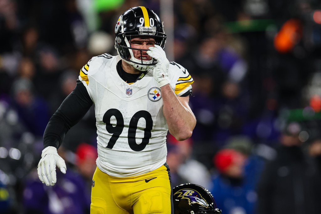 T.J. Watt #90 of the Pittsburgh Steelers reacts after a play against the Baltimore Ravens during the first half of the AFC Wild Card Playoff game at M&T Bank Stadium on January 11, 2025 in Baltimore, Maryland. 
