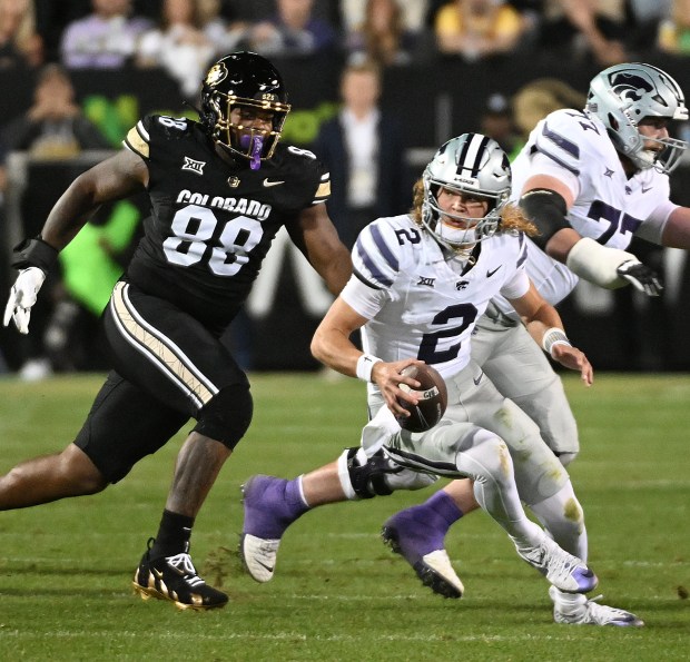 Colorado's Amari McNeill tries to chase down Kansas State quarterback Avery Johnson at Folsom Field in Boulder, Colo., on Oct. 12, 2024. (Cliff Grassmick/Staff Photographer)