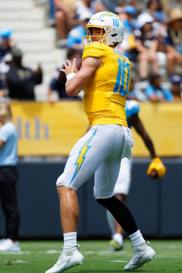 Chargers quarterback Justin Herbert drops back to pass during a...