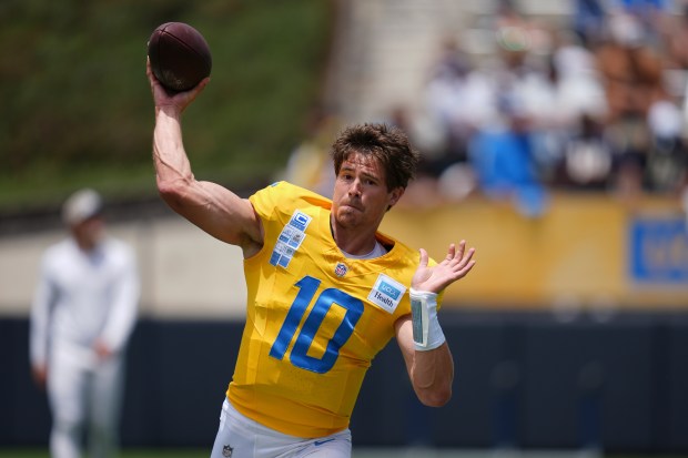 Chargers quarterback Justin Herbert throws a pass during a training...