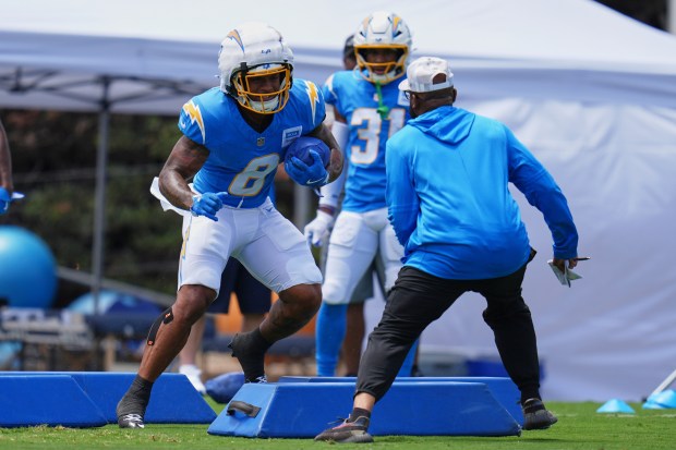 Chargers rookie running back Omarion Hampton goes through a drill...