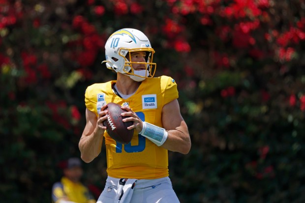 Chargers quarterback Justin Herbert drops back to pass during a...
