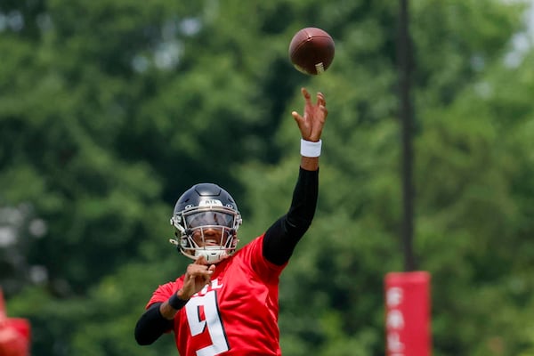 Falcons quarterback Michael Penix Jr., here throwing in minicamp in June, is QB1 this training camp. (Miguel Martinez/AJC)