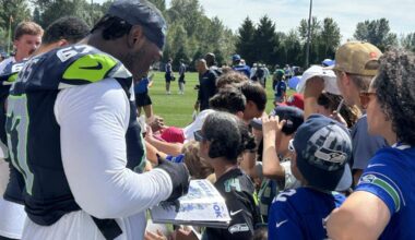Seahawks left tackle Charles Cross signs autographs for fans following the fourth practice of Seattle&#x002019;s NFL training camp Saturday, July 26, 2025, at the Virginia Mason Athletic Center in Renton.