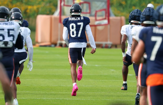 Chicago Bears wide receiver Luther Burden III (87) stretches out during training camp on July 28, 2025, in Lake Forest. (Stacey Wescott/Chicago Tribune)