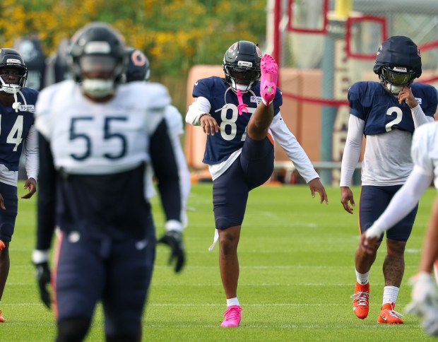 Chicago Bears wide receiver Luther Burden III (87) stretches out during training camp on July 28, 2025, in Lake Forest. (Stacey Wescott/Chicago Tribune)