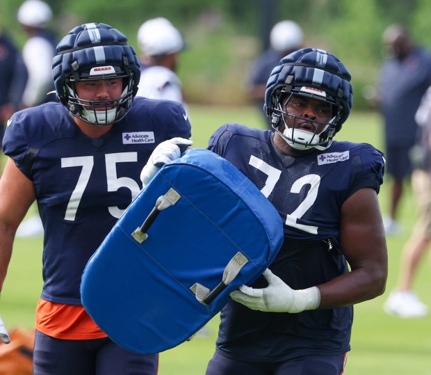 Chicago Bears offensive tackle Ozzy Trapilo (75), left, and Chicago Bears offensive tackle Kiran Amegadjie (72) during training camp on July 28, 2025, in Lake Forest. (Stacey Wescott/Chicago Tribune)