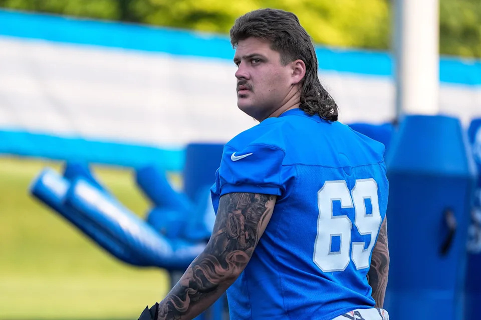 Detroit Lions guard Tate Ratledge (69) walks onto the field for practice during training camp at Meijer Performance Center in Allen Park on Monday, July 21, 2025.