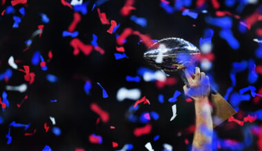 New England Patriots legend Tom Brady holds up Lombardi Trophy