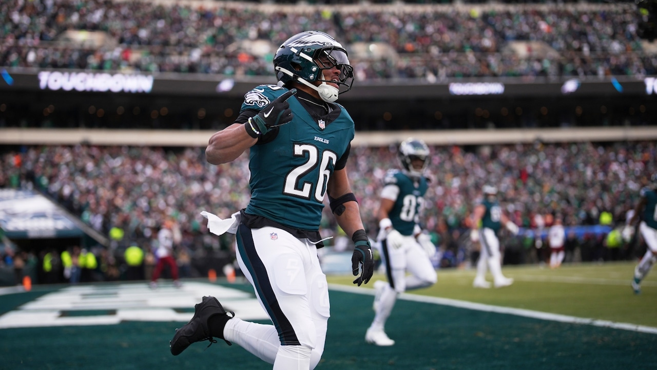 hiladelphia Eagles running back Saquon Barkley (26) celebrates after running for a touchdown against the Washington Commanders during the first half of the NFC Championship NFL football game, Sunday, Jan. 26, 2025, in Philadelphia.