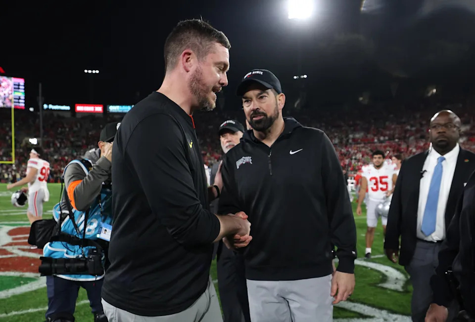 PASADENA, CALIFORNIA - JANUARY 01: Head coach Dan Lanning of the Oregon Ducks and head coach Ryan Day of the Ohio State Buckeyes shake hands after the Rose Bowl Game Presented by Prudential at Rose Bowl Stadium on January 01, 2025 in Pasadena, California. (Photo by Harry How/Getty Images)