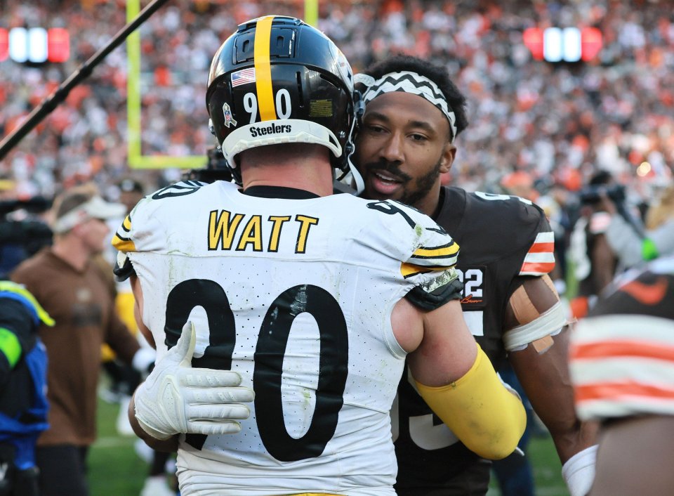 Pittsburgh Steelers' TJ Watt (90) and Cleveland Browns' Myles Garrett (95) talking after a game.