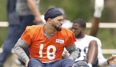Chicago Bears Caleb Williams gives a fan a tattoo