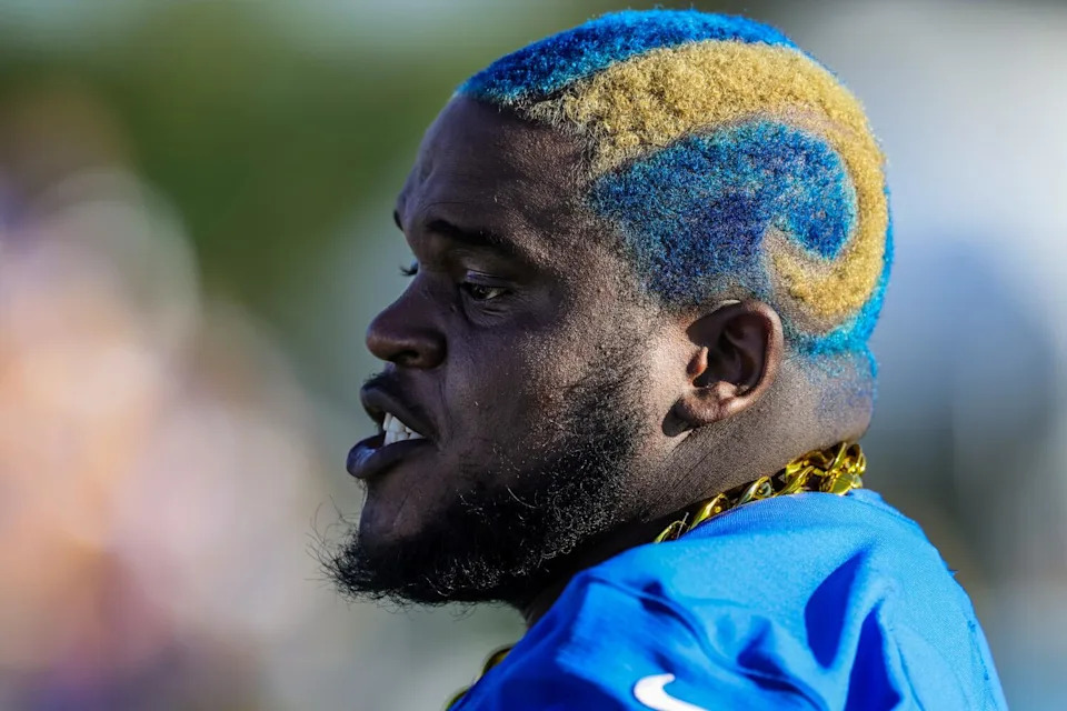 Rams offensive lineman Kevin Dotson shows off his Rams-inspired hairdo.