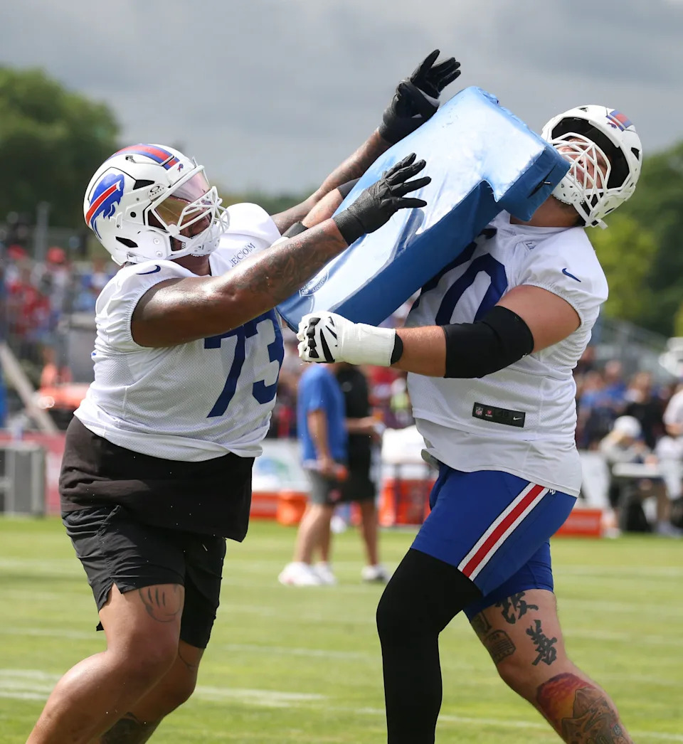 Bills offensive lineman Dion Dawkins collides with Alec Anderson during position drills during day three of Buffalo Bills training camp at St. John Fisher University Friday, July 25, 2025 in Pittsford, NY.