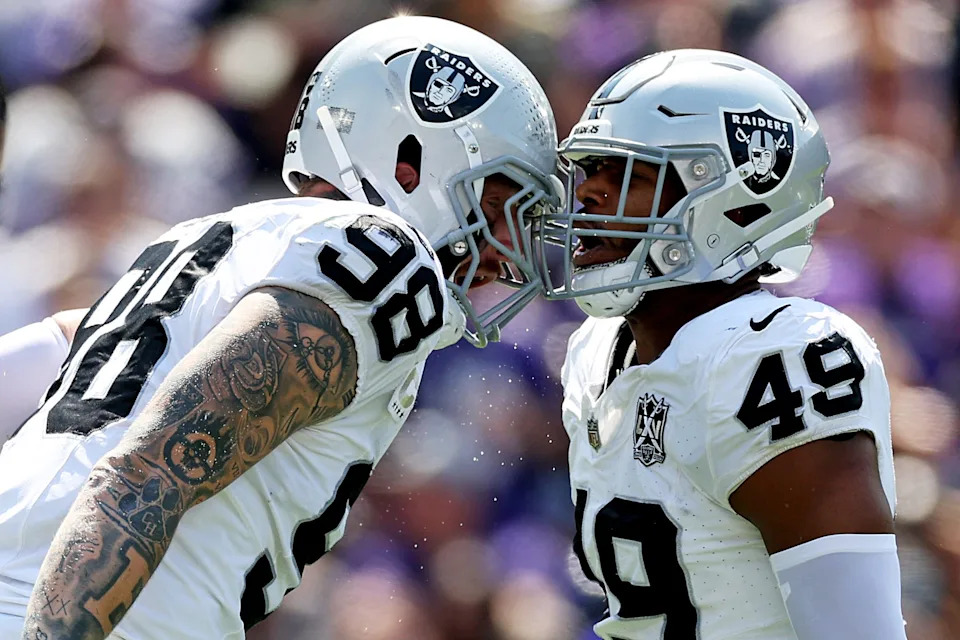 BALTIMORE, MARYLAND - SEPTEMBER 15: Maxx Crosby #98 and Charles Snowden #49 of the Las Vegas Raiders celebrate a tackle during the first quarter at M&T Bank Stadium on September 15, 2024 in Baltimore, Maryland. (Photo by Patrick Smith/Getty Images)